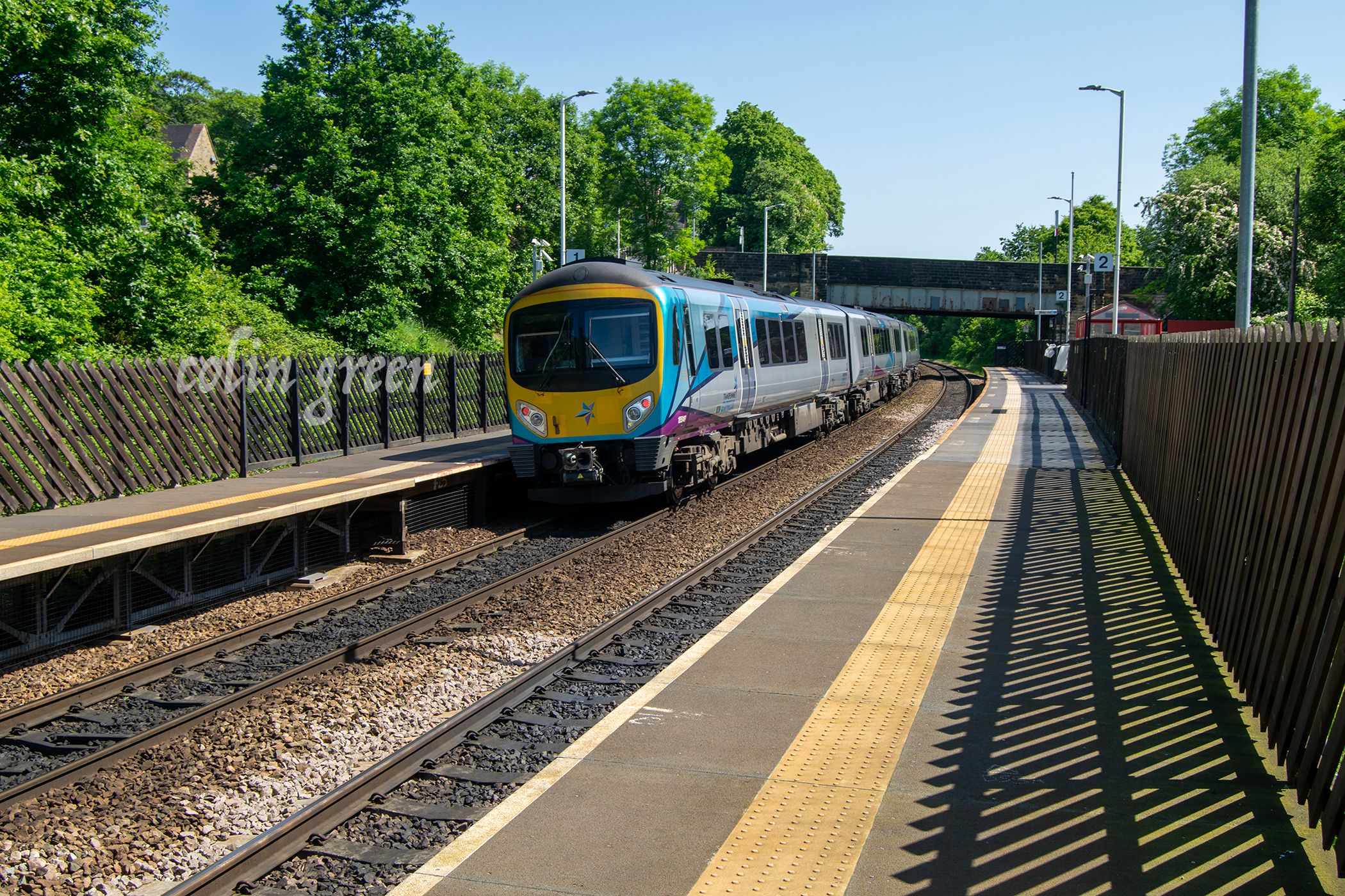 An image of a Trans Pennine Express Train on Platform 1 at Deighton Railway Station, Huddersfield.