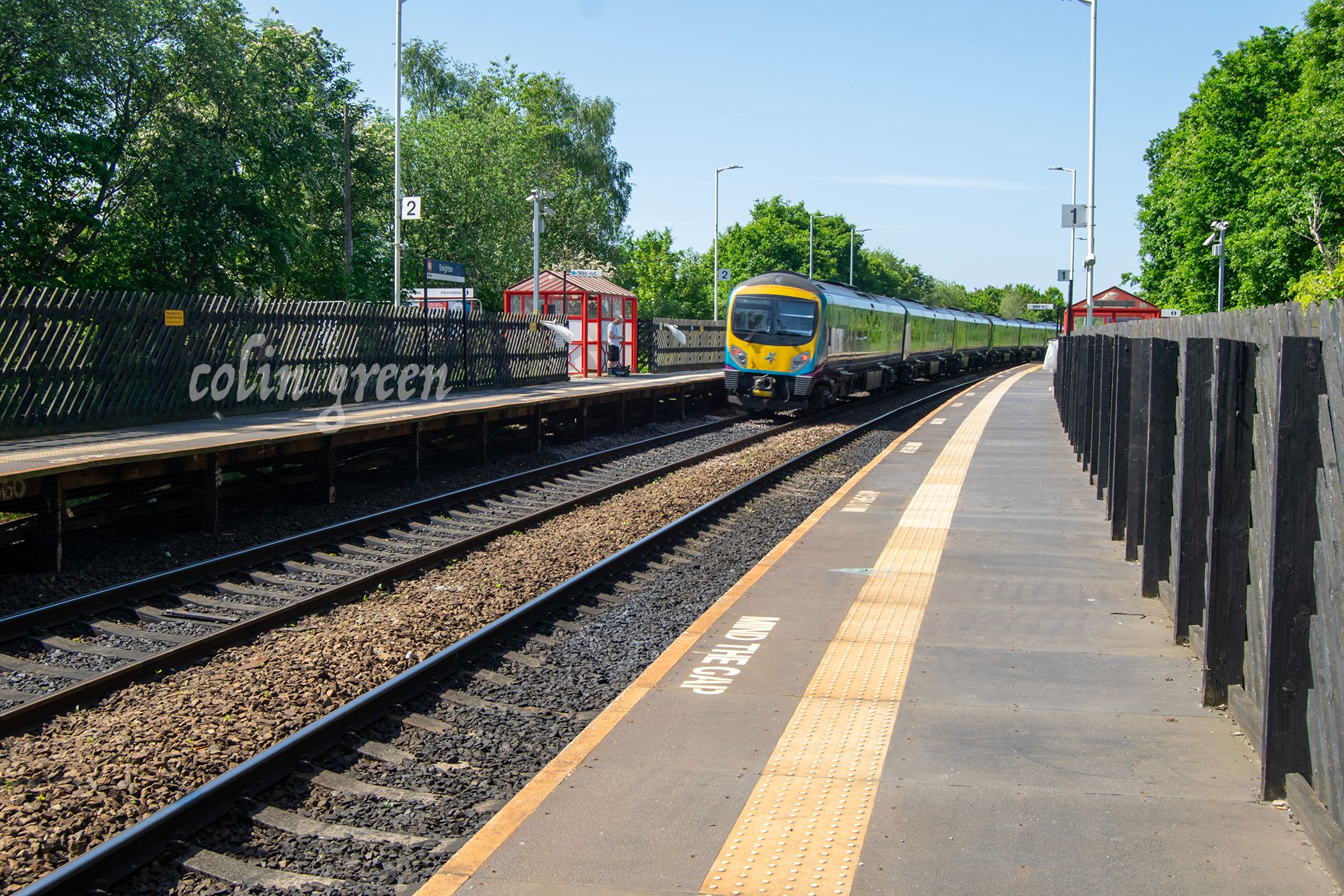 Image of a Trans Pennine Express Train passing through Deighton Railway Station, Near Huddersfield.