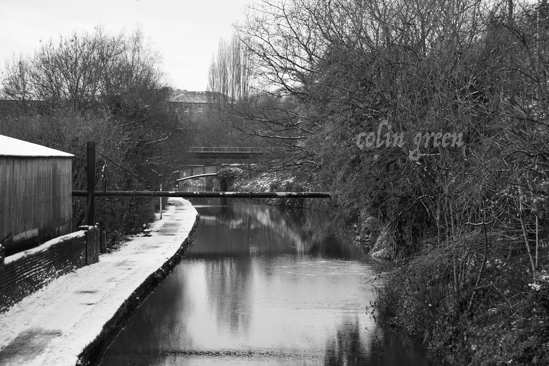 A black and white picture showing the Calder and Hebble Navigation canal near Sowerby Bridge, West Yorkshire.