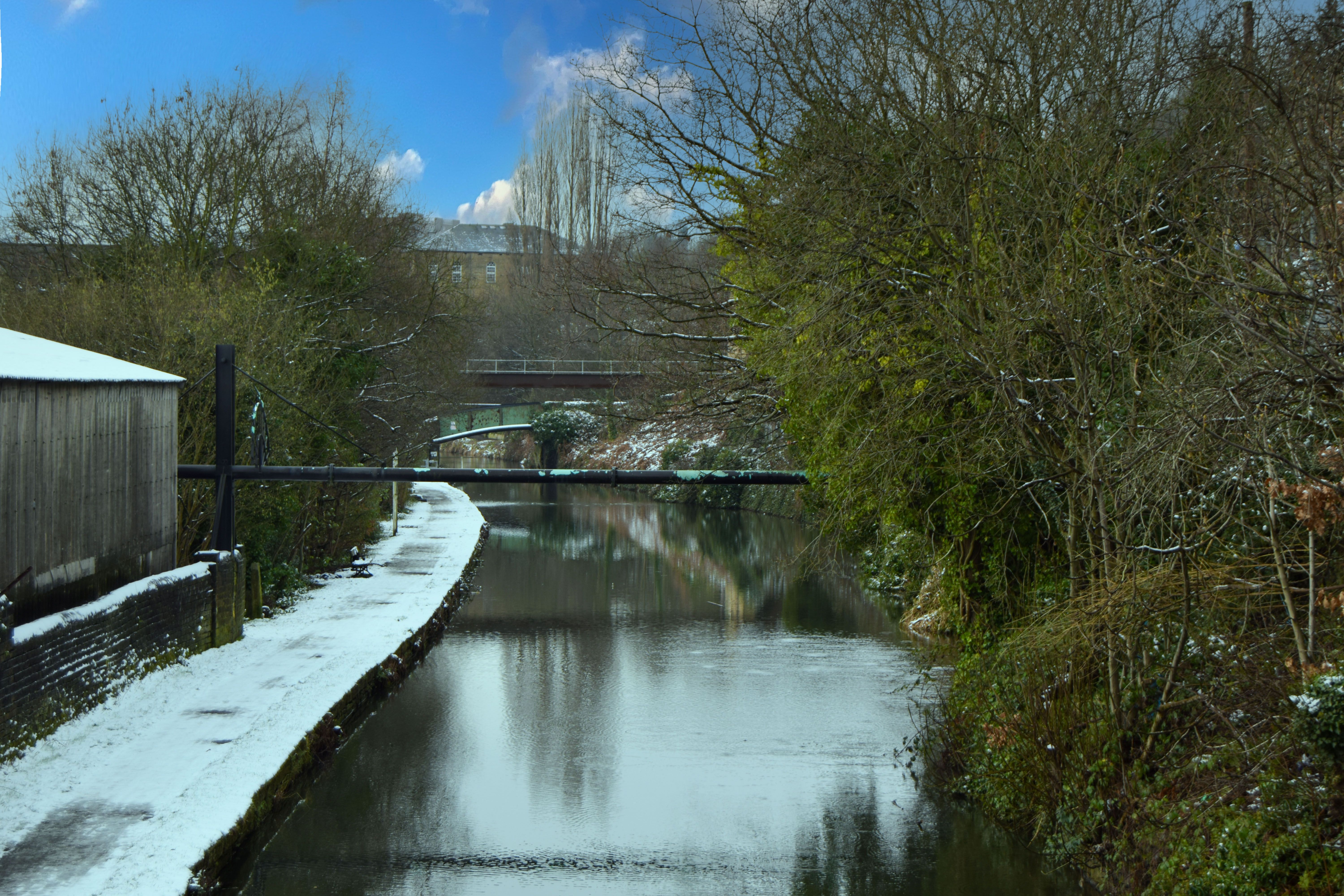 A colour image showing the Calder and Hebble Navigation Canal towards Chain Bridge, the first crossing over the canal at Chain Bridge, West Yorkshire.