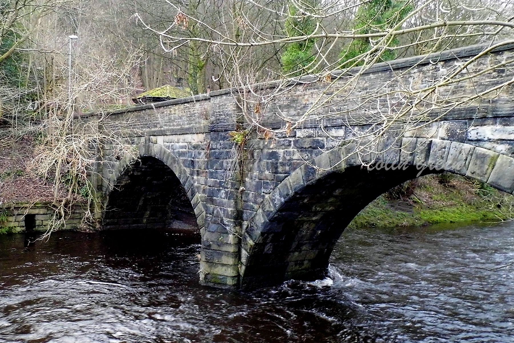 Stone 2 arch bridge over the River Calder at Copley, West Yorkshire