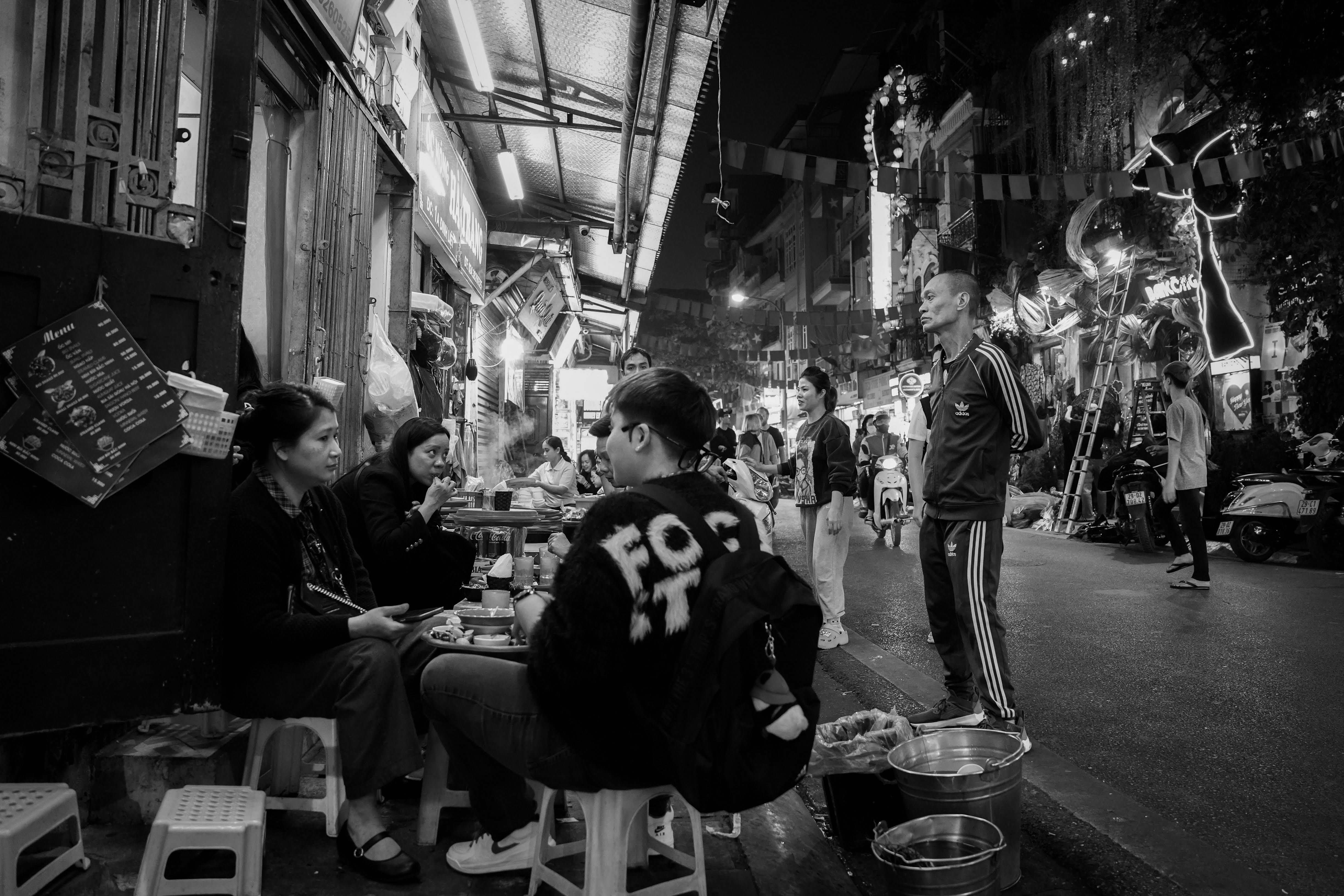 Street life at the Old Quarter of Hanoi in Vietnam Southeast Asia by ...